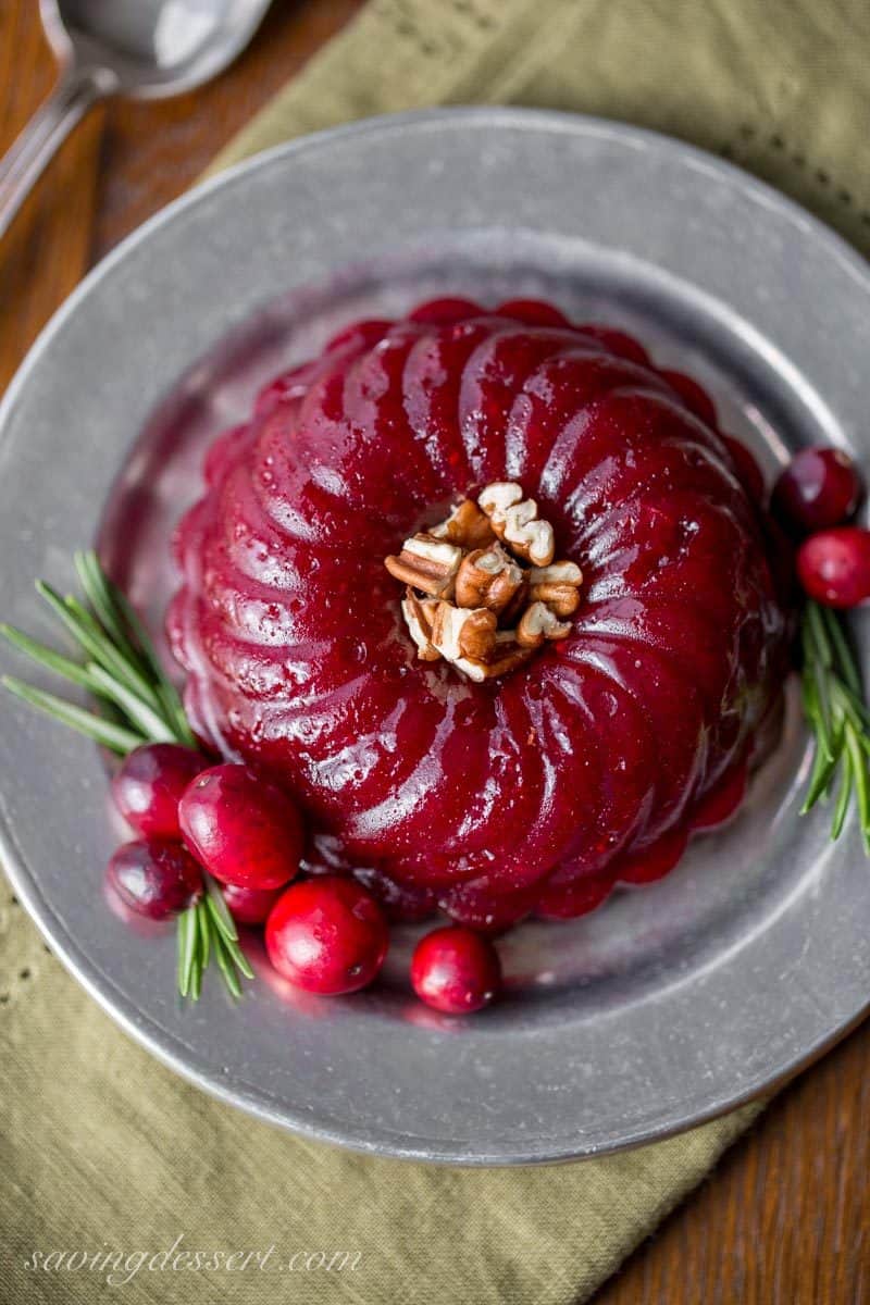 Boozy Cranberry Sauce - Ruby Port wine and Grand Marnier make a terrific pair when matched with tart cranberries, fresh rosemary and sliced ginger in this deliciously easy, grown-up, Boozy Cranberry Sauce. www.savingdessert.com