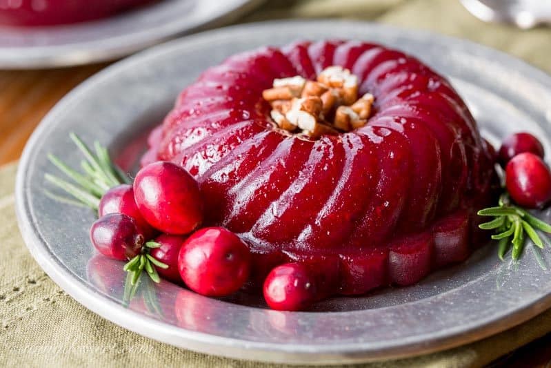 Boozy Cranberry Sauce - Ruby Port wine and Grand Marnier make a terrific pair when matched with tart cranberries, fresh rosemary and sliced ginger in this deliciously easy, grown-up, Boozy Cranberry Sauce. www.savingdessert.com