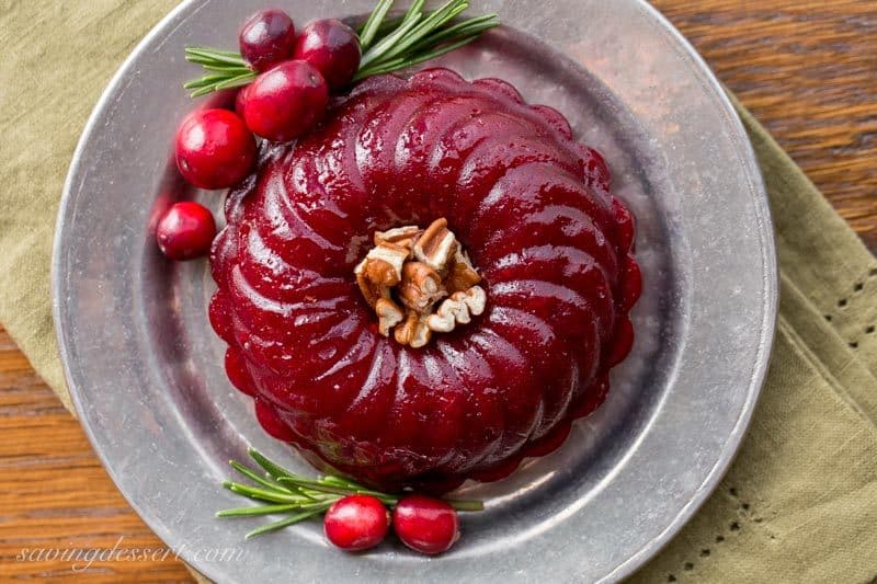 Boozy Cranberry Sauce - Ruby Port wine and Grand Marnier make a terrific pair when matched with tart cranberries, fresh rosemary and sliced ginger in this deliciously easy, grown-up, Boozy Cranberry Sauce. www.savingdessert.com
