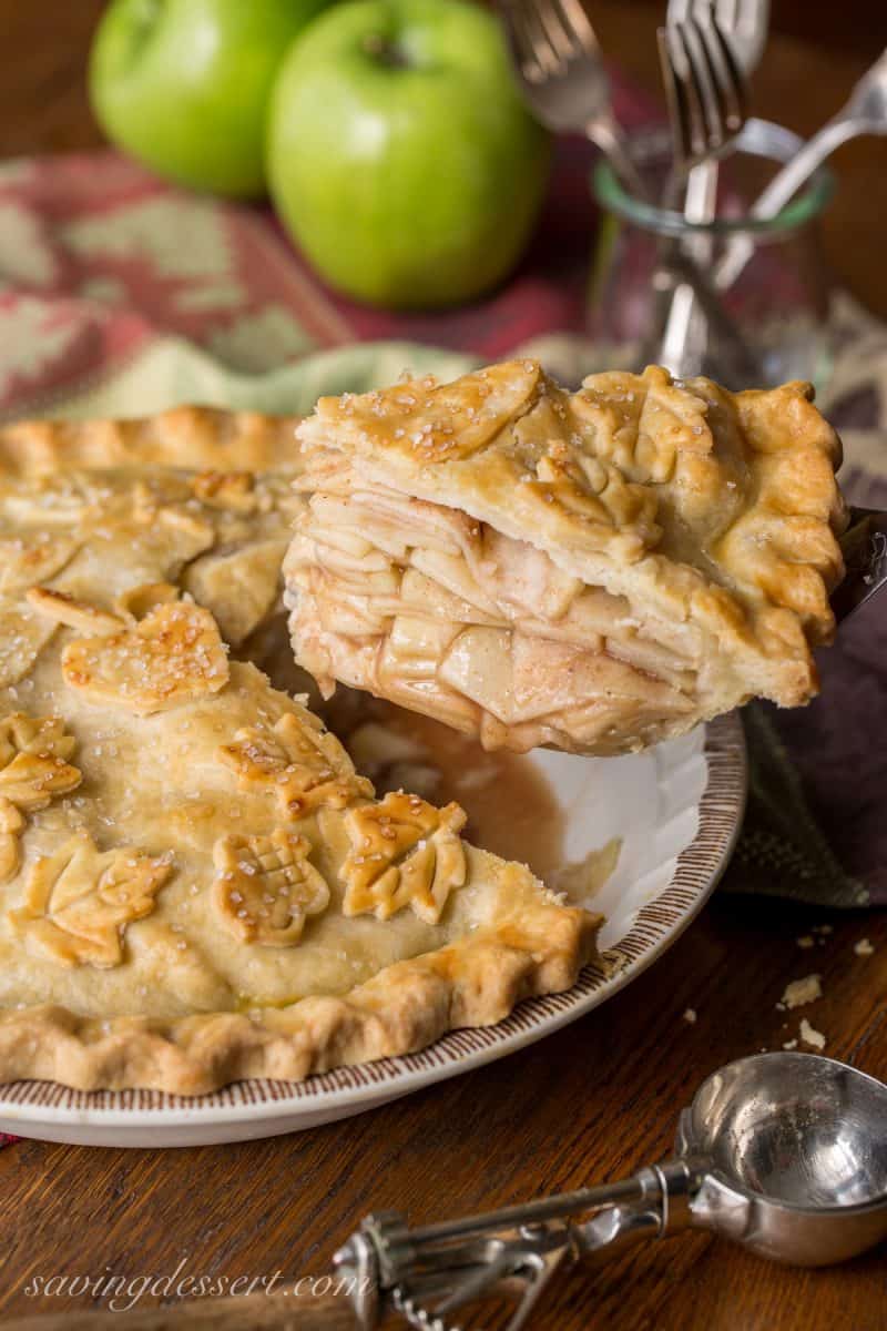 Classic Double Crust Apple Pie Recipe - the filling is made with tart, crisp apples then wrapped in a buttery, flaky pastry dough. Baked until golden brown then served warm with a scoop of ice cream. Nothing says home like apple pie! www.savingdessert.com