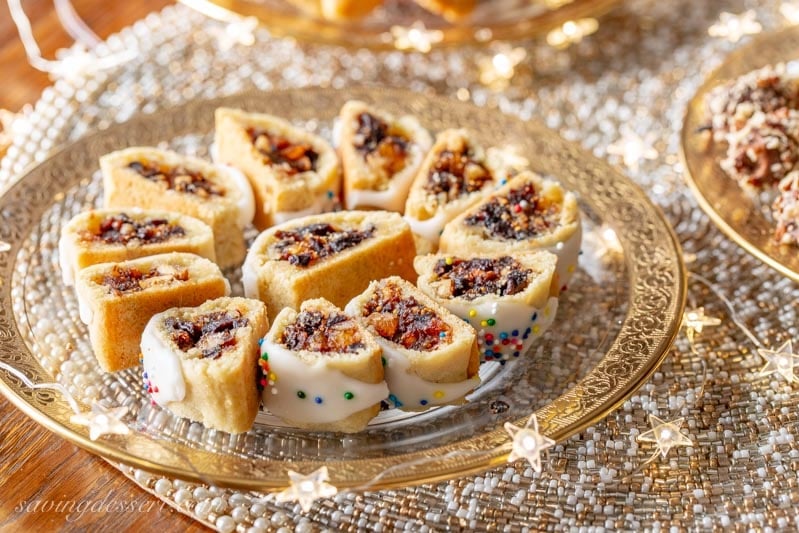 A holiday plate of Italian Fig Cookies with colorful sprinkles