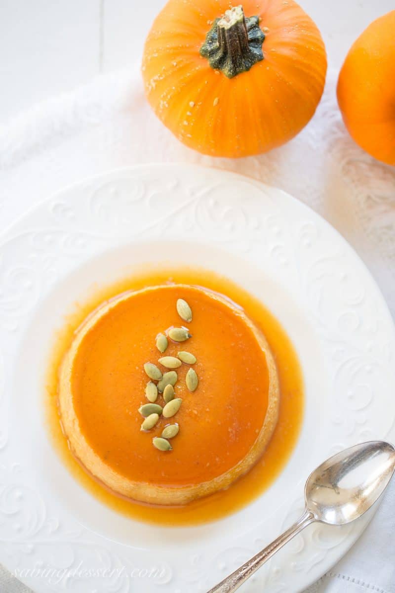 Pumpkin Caramel Flan - a silky smooth, creamy custard that's loaded with pumpkin, and pumpkin pie spice, with a layer of soft caramel on top. www.savingdessert.com