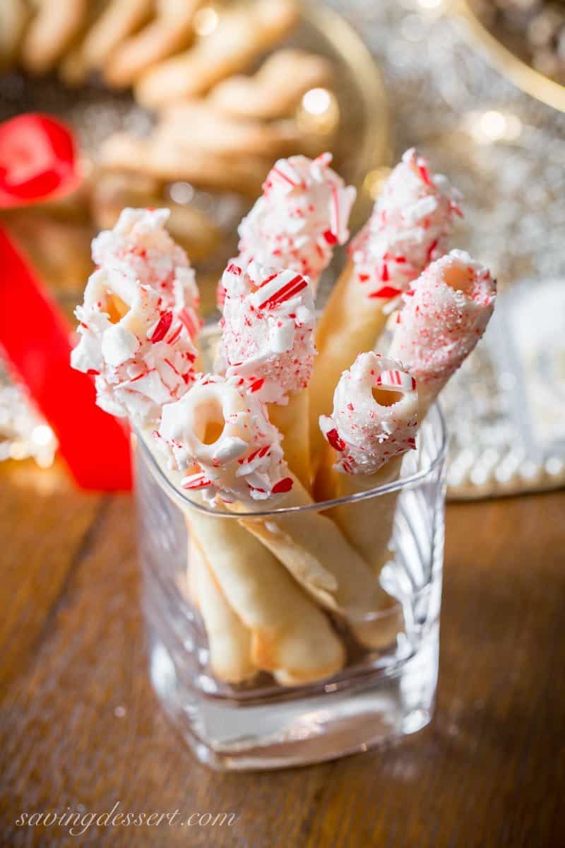 Tuile Cigar Cookies, also known as pirouettes, are crisp, delicate little cookies with a perfect vanilla flavor and buttery crunch. www.savingdessert.com