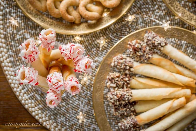 Tuile Cigar Cookies, also known as pirouettes, are crisp, delicate little cookies with a perfect vanilla flavor and buttery crunch. www.savingdessert.com