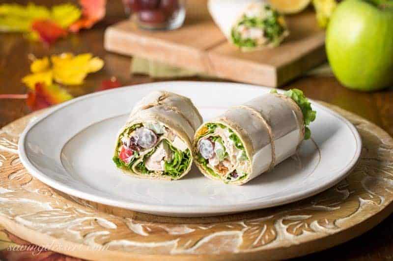 Turkey Waldorf Wraps - with tender roasted turkey, shredded cheese and a light, fruity Waldorf Salad rolled up in a simple Lavash flatbread. www.savingdessert.com