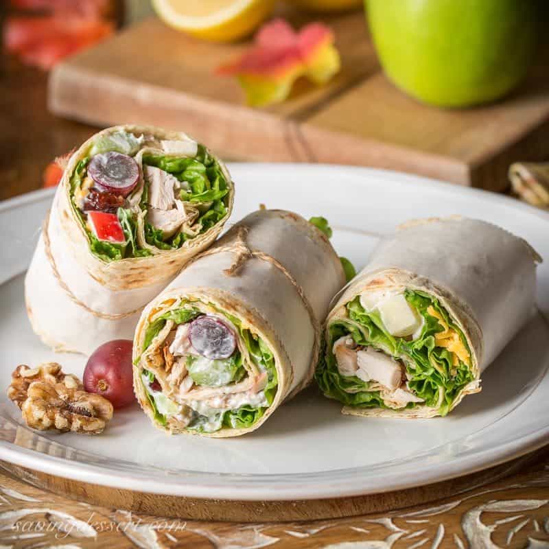 Turkey Waldorf Wraps - with tender roasted turkey, shredded cheese and a light, fruity Waldorf Salad rolled up in a simple Lavash flatbread. www.savingdessert.com