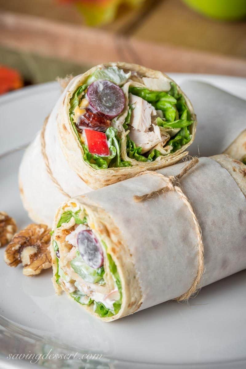 Turkey Waldorf Wraps - with tender roasted turkey, shredded cheese and a light, fruity Waldorf Salad rolled up in a simple Lavash flatbread. www.savingdessert.com