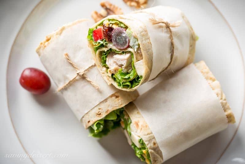 Turkey Waldorf Wraps - with tender roasted turkey, shredded cheese and a light, fruity Waldorf Salad rolled up in a simple Lavash flatbread. www.savingdessert.com