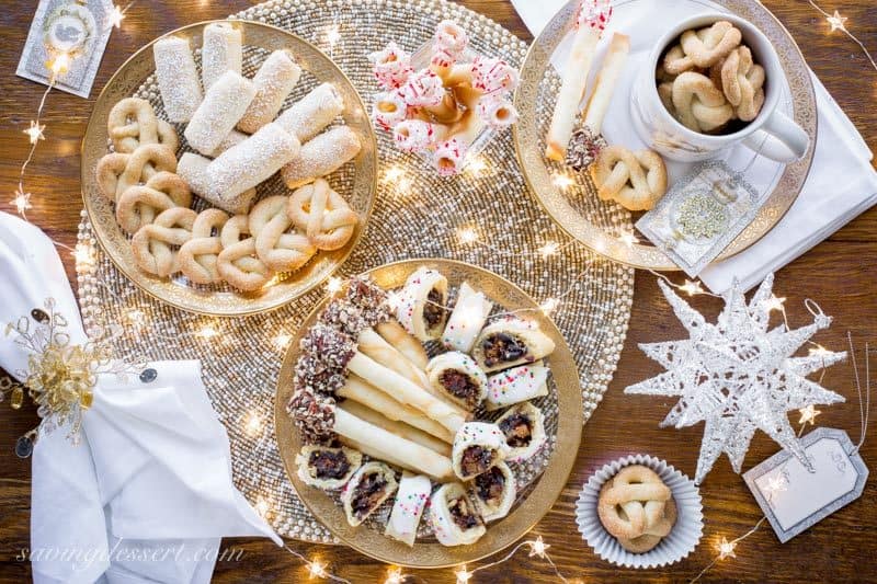 A buffet of delicious holiday cookies with sparkly lights and decorations