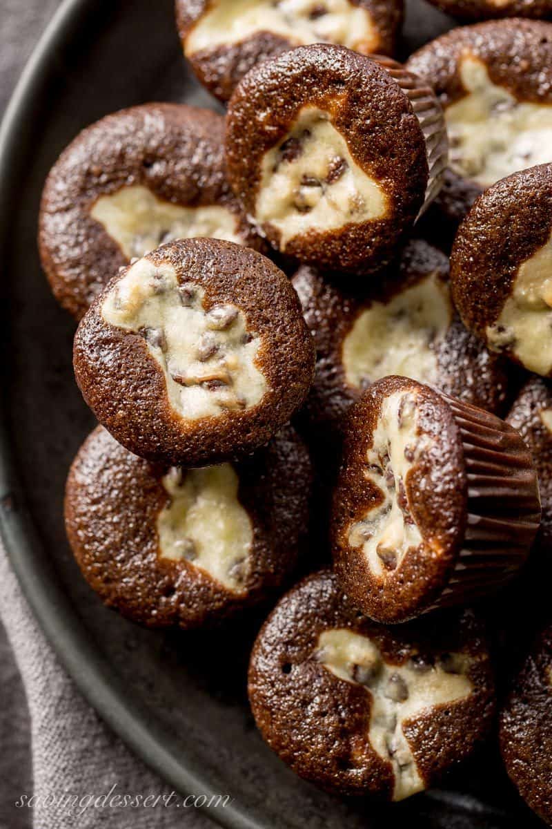 Mini Black Bottoms - a delicious fudgy cake topped with a cheesecake dough mixed with mini chocolate chips. So easy to make and super easy to eat! www.savingdessert.com 