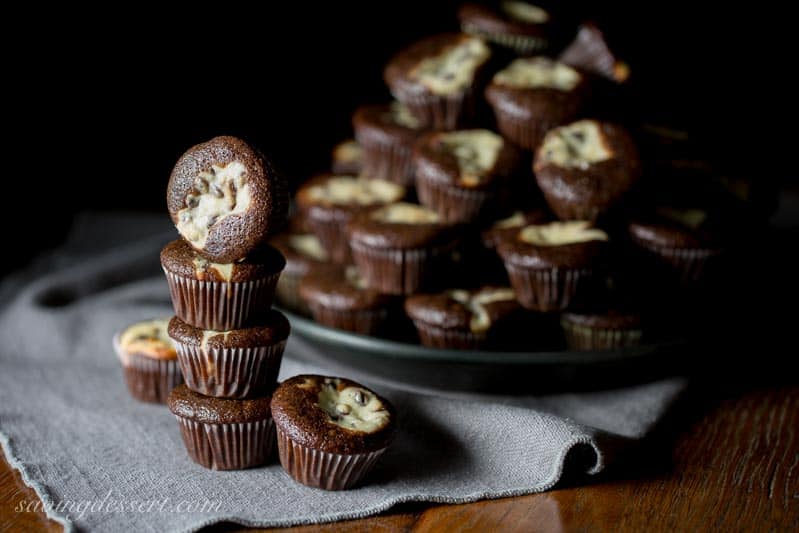 Mini Black Bottoms - a delicious fudgy cake topped with a cheesecake dough mixed with mini chocolate chips. So easy to make and super easy to eat! www.savingdessert.com 