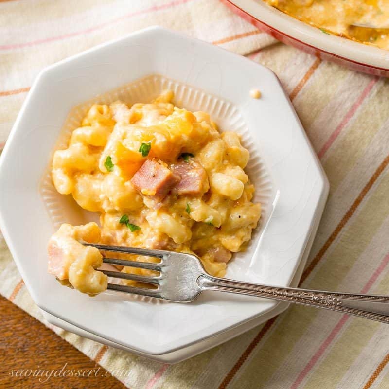 Creamy & rich, Ham Macaroni & Cheese. What could be more comforting than a steaming bowl of macaroni and cheese loaded with sweet ham? www.savingdessert.com