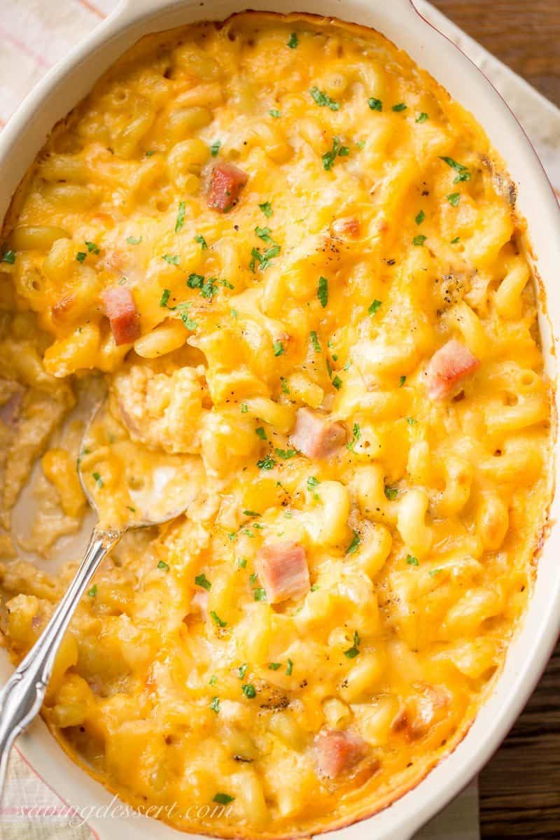 Creamy & rich, Ham Macaroni & Cheese. What could be more comforting than a steaming bowl of macaroni and cheese loaded with sweet ham? www.savingdessert.com