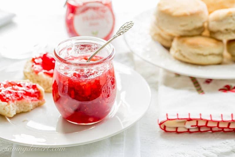 Holiday Jam ~ a wonderful combination of cranberries, raspberries, and pears with a touch of spice and a splash of Grand Marnier! This quick & easy freezer jam recipe will thrill you and your guests. Dressed up in a pretty jar, this makes a wonderful gift! www.savingdessert.com