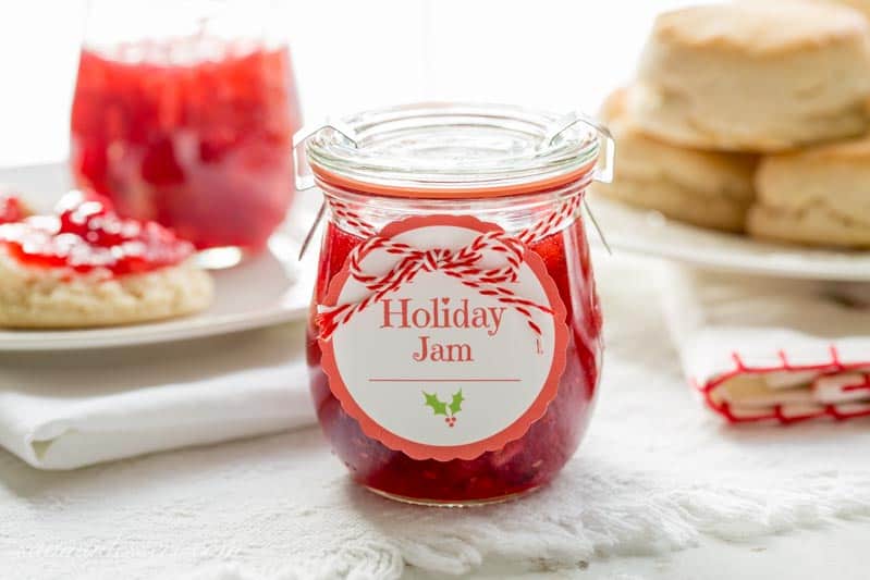 Holiday Jam ~ a wonderful combination of cranberries, raspberries, and pears with a touch of spice and a splash of Grand Marnier! This quick & easy freezer jam recipe will thrill you and your guests. Dressed up in a pretty jar, this makes a wonderful gift! www.savingdessert.com
