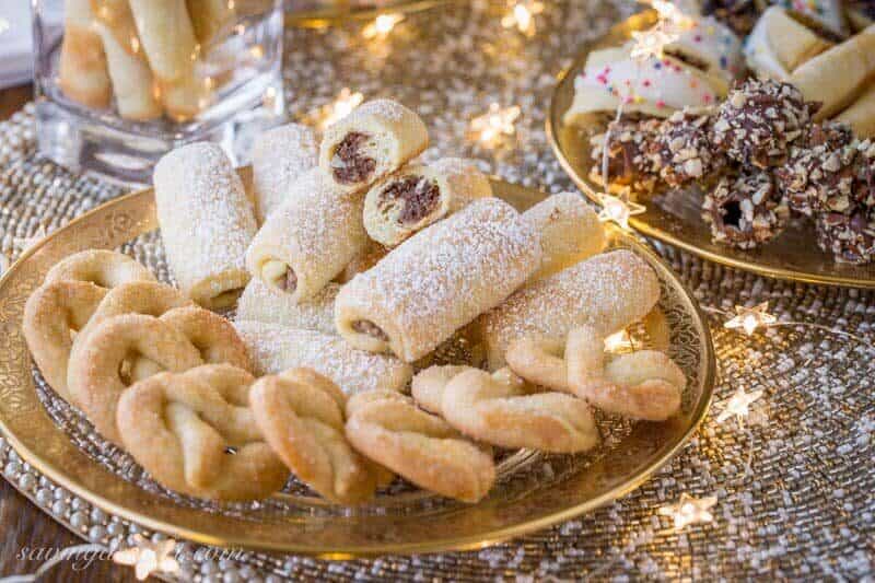 Roczki Cookies (Kolacky) are made with a tender, yeasted dough rolled up in a cigar shape with a simple, lemony, ground nut filling. www.savingdessert.com