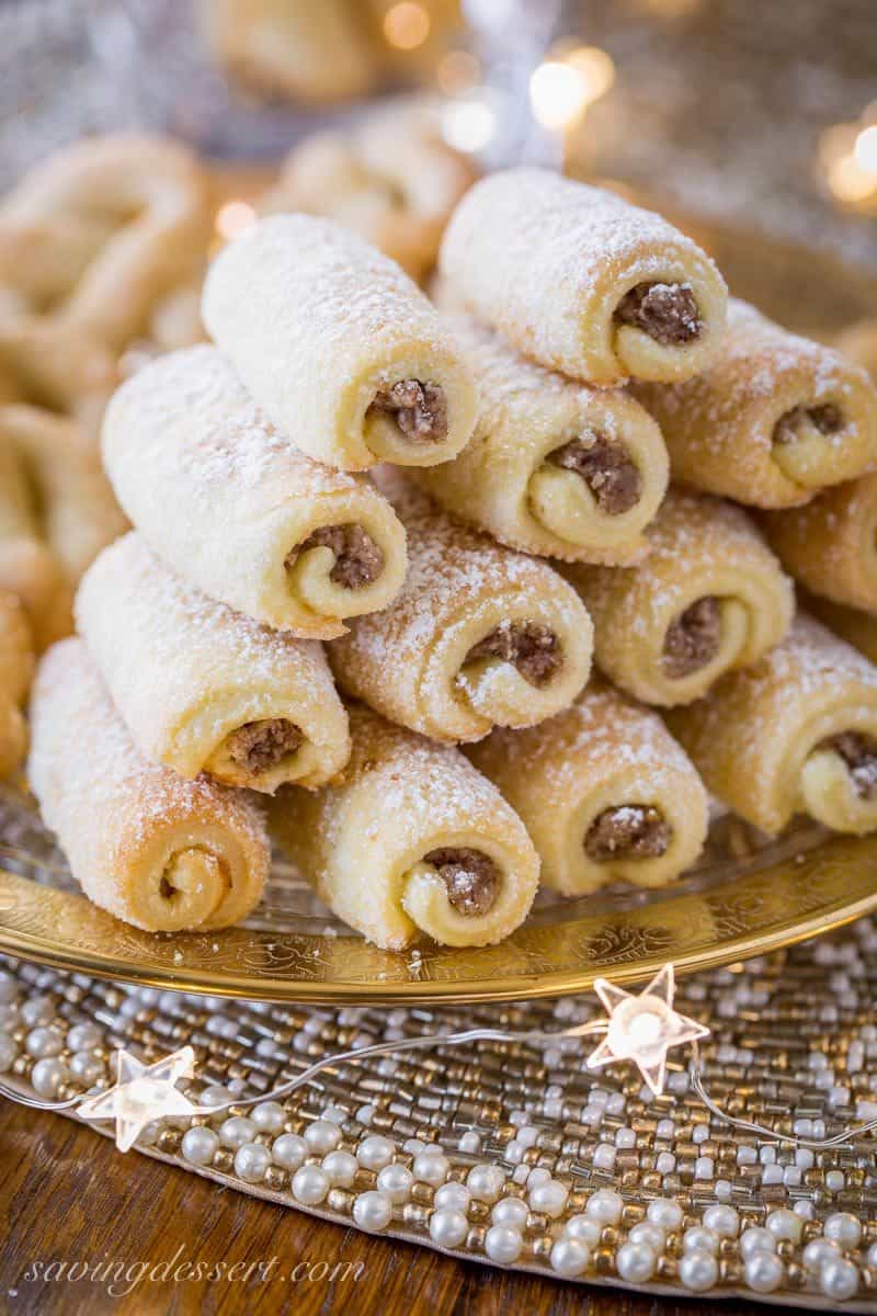 Roczki Cookies (Kolacky) are made with a tender, yeasted dough rolled up in a cigar shape with a simple, lemony, ground nut filling. www.savingdessert.com