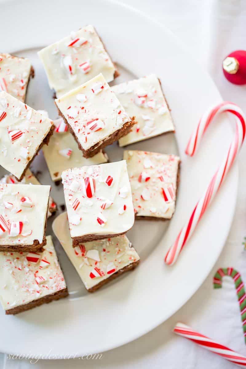 White Chocolate Peppermint Brownies - Lightly sweet, cakey chocolate brownies topped with melted white chocolate and crushed peppermints for a simple, easy and tasty dessert to help celebrate the season. www.savingdessert.com