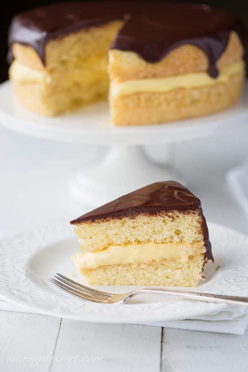 Classic Boston Cream Pie ~ moist, tender sponge cake filled with a layer of rich, smooth vanilla pastry cream, then topped with a delicious bittersweet chocolate glaze. | chocolate | Boston Cream Pie | Pastry Cream | chocolate ganache | www.savingdessert.com