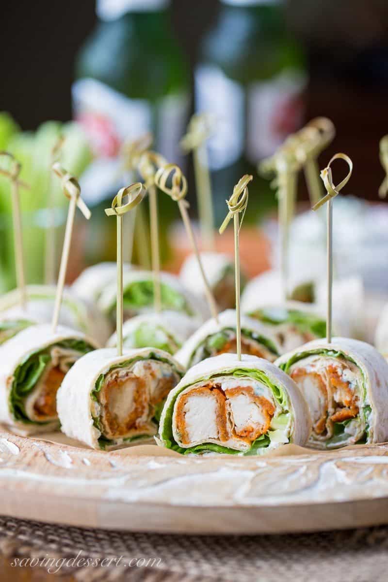 Buffalo Chicken wraps cut into small appetizers with blue cheese