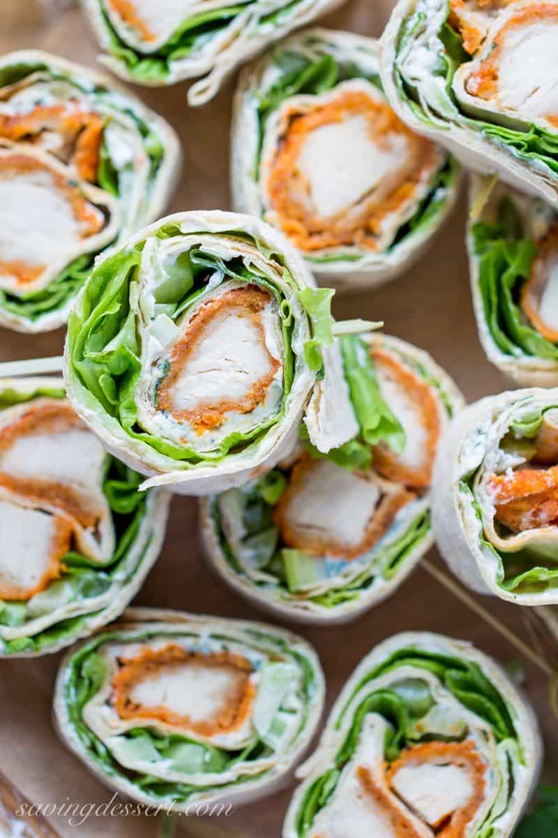 Buffalo Chicken Roll Up Appetizers ~ made with all-natural frozen chicken tenders tossed in hot sauce, then rolled up with a homemade blue cheese dip, celery, and crisp lettuce. blue cheese | buffalo chicken | appetizer | roll ups | wraps | www.savingdessert.com 