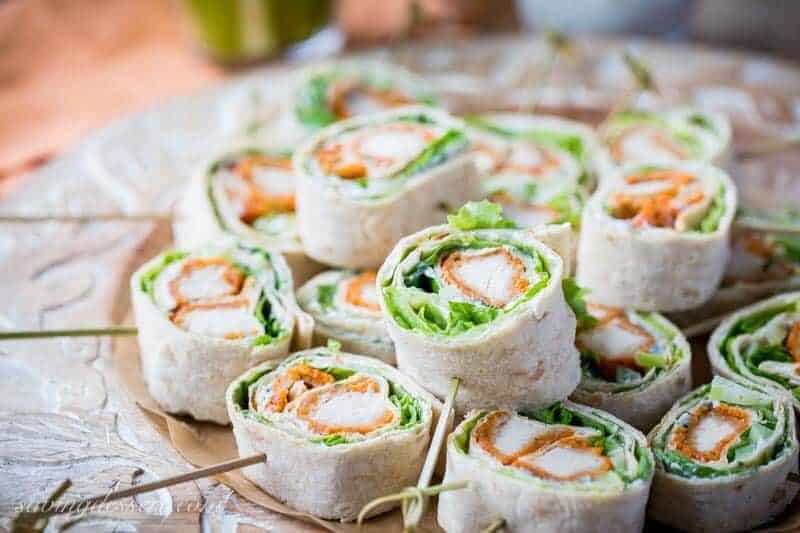 Buffalo Chicken Roll Up Appetizers ~ made with all-natural frozen chicken tenders tossed in hot sauce, then rolled up with a homemade blue cheese dip, celery, and crisp lettuce. blue cheese | buffalo chicken | appetizer | roll ups | wraps | www.savingdessert.com 