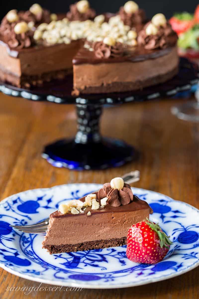 Chocolate Hazelnut Mousse Cake ~ a light and fluffy Nutella chocolate mousse spread over a chocolate hazelnut shortbread crust, topped with a simple chocolate ganache and garnished with chopped toasted hazelnuts. www.savingdessert.com