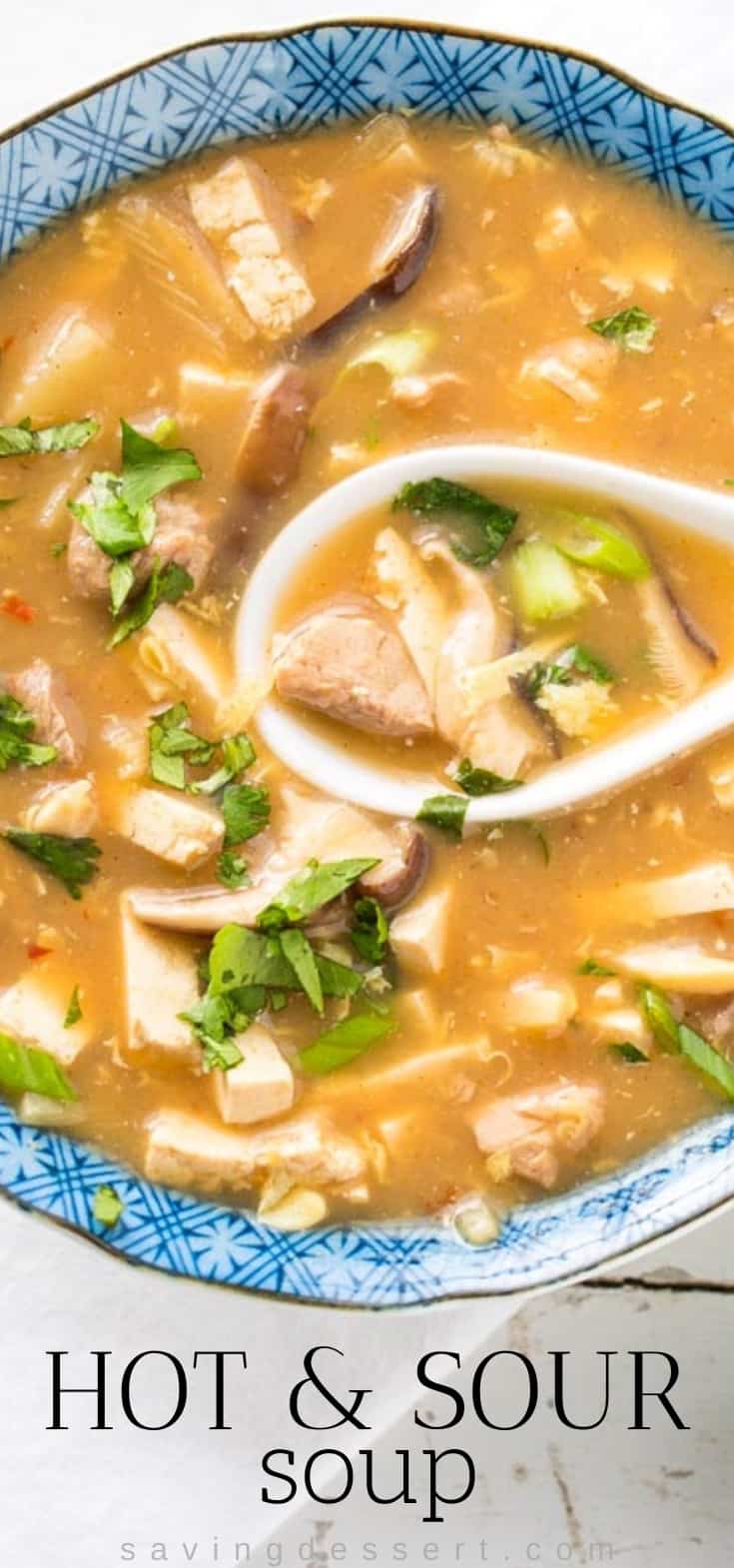 A bowl of homemade hot and sour soup garnished with cilantro