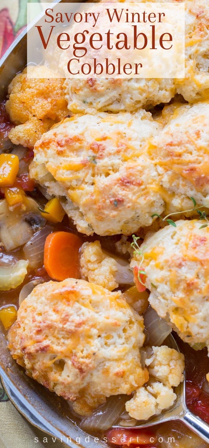 An overhead view of a skillet vegetable cobbler with biscuit topping