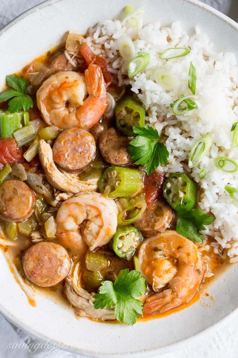 An overhead view of a bowl of authentic Cajun sausage Gumbo with chicken and shrimp served over rice