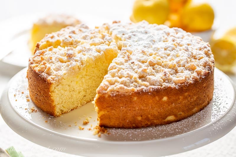 A single layer lemon cake with a sweet crumbled topping