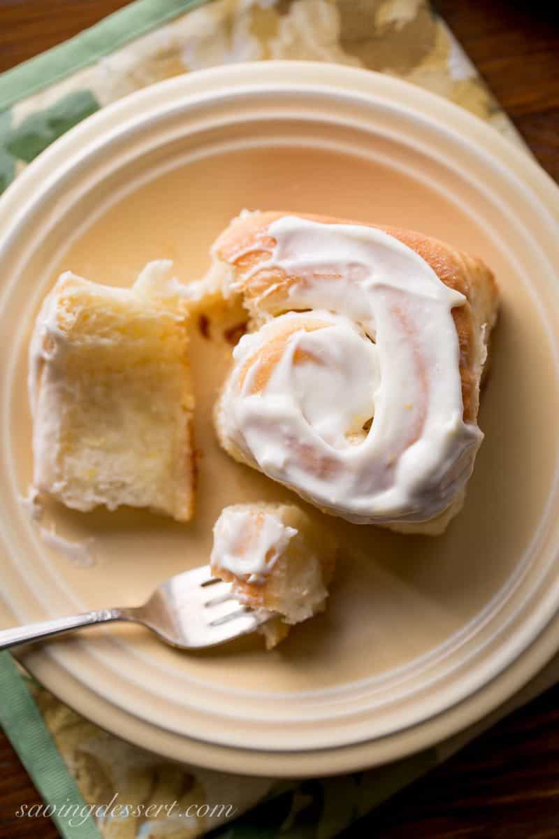 Lemon Sweet Rolls with Lemon Cream Cheese Icing ~ a lightly sweet, soft yeast roll with a lemon infused dough, and a sweet lemon filling, topped with a lemony cream cheese icing. Weekend baking at it's best! www.savingdessert.com