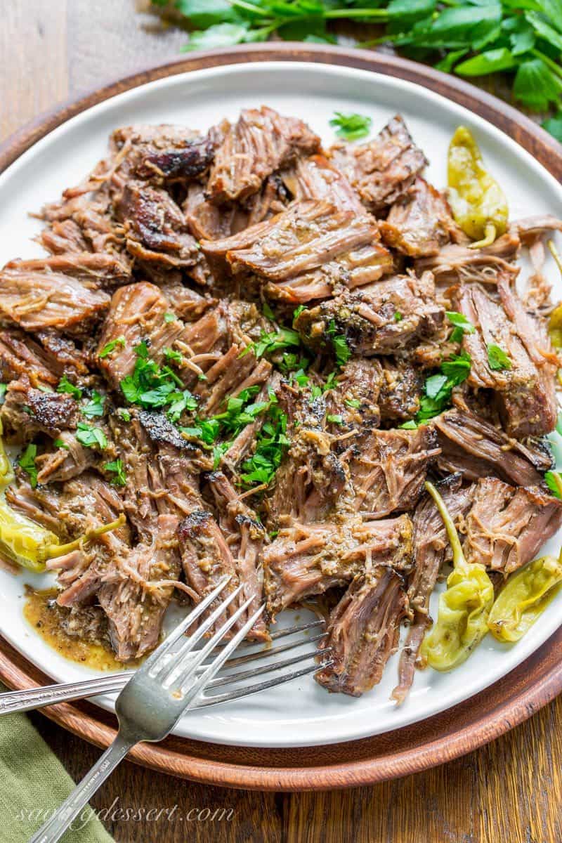 A plate of tender beef pot roast with peppers