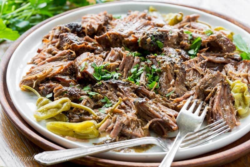 Mississippi Pot Roast - a tender, well flavored slow cooker pot roast with pepperoncini peppers and a simple homemade ranch dressing. The briny little peppers add a spicy punch of flavor, and it couldn't be easier to make! www.savingdessert.com