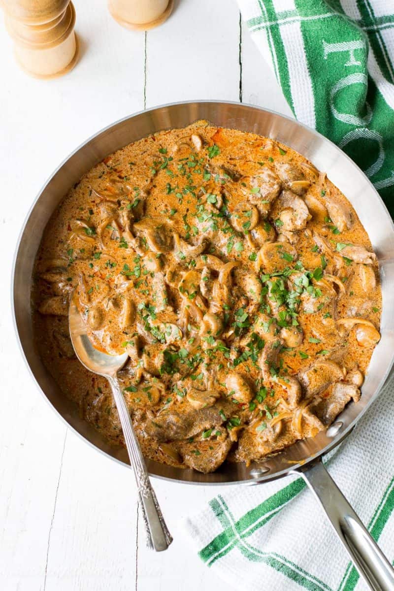 A skillet of Beef Stroganoff with parsley