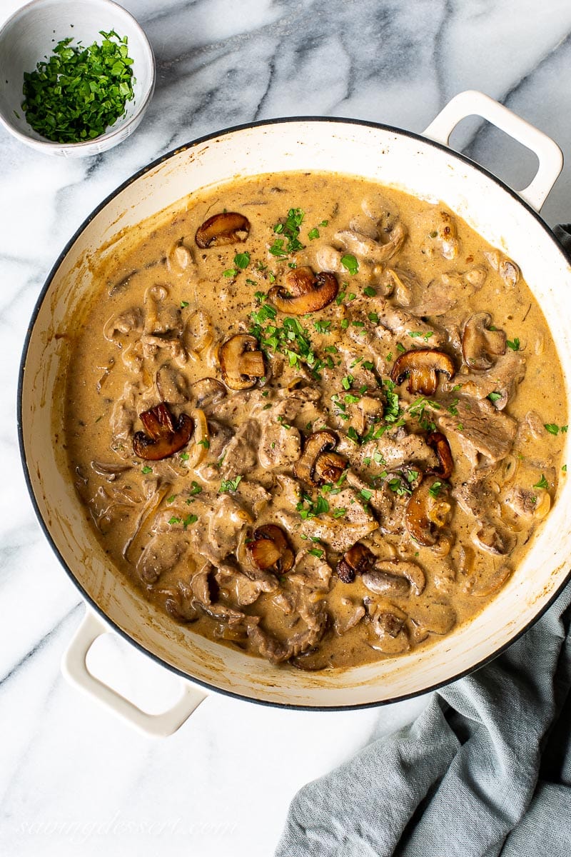 Beef Stroganoff sauce in a white skillet