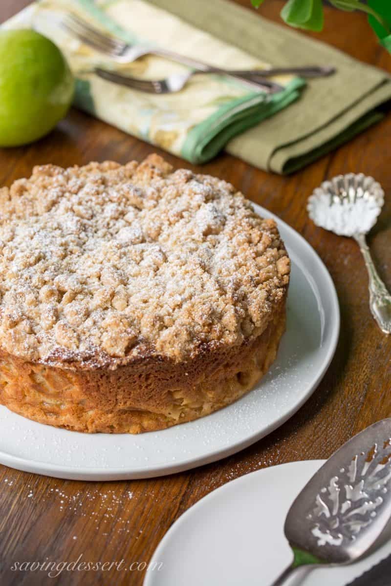 Irish Apple Crumble Cake with Apple Brandy Sauce ~ made with fresh apples, plenty of cinnamon, and a sweet crumble top, this rustic and moist cake is homey and delightful especially when drizzled with the Apple Brandy Sauce! www.savingdessert.com