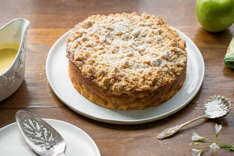 Irish Apple Crumble Cake with Apple Brandy Sauce ~ made with fresh apples, plenty of cinnamon, and a sweet crumble top, this rustic and moist cake is homey and delightful especially when drizzled with the Apple Brandy Sauce! www.savingdessert.com