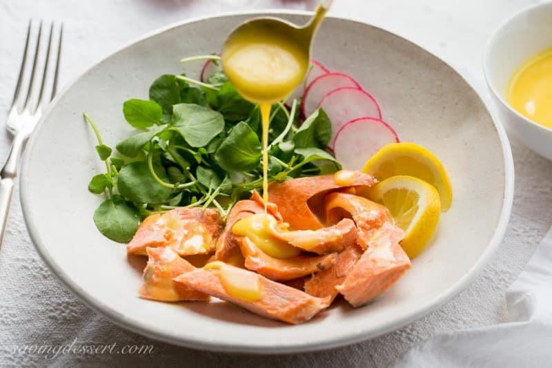 Poached Salmon with Irish Butter Sauce - Wild caught salmon is gently poached in salted water then topped with a lemony butter sauce. The salmon and sauce can be ready in about 20 minutes so that makes this a delicious, quick and easy meal for any night of the week. www.savingdessert.com