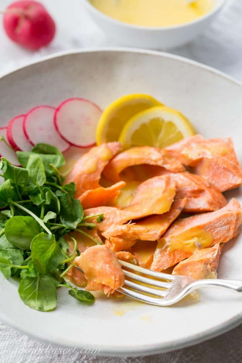 Poached Salmon with Irish Butter Sauce - Wild caught salmon is gently poached in salted water then topped with a lemony butter sauce. The salmon and sauce can be ready in about 20 minutes so that makes this a delicious, quick and easy meal for any night of the week. www.savingdessert.com