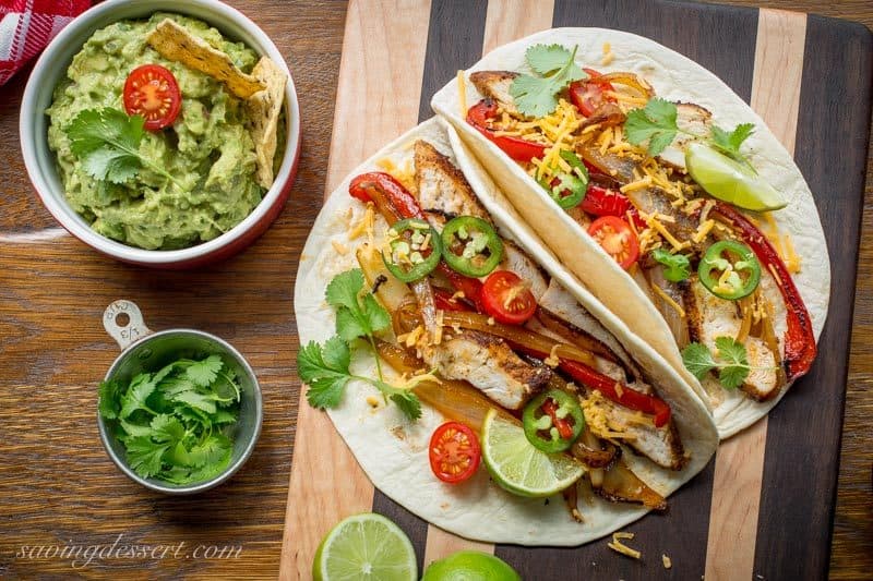 Skillet Chicken Fajitas ~ incredibly easy to make, loaded with bold flavor, sweet sautéed vegetables and tender, juicy chicken. www.savingdessert.com