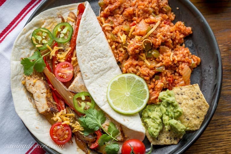 Skillet Chicken Fajitas ~ incredibly easy to make, loaded with bold flavor, sweet sautéed vegetables and tender, juicy chicken. www.savingdessert.com