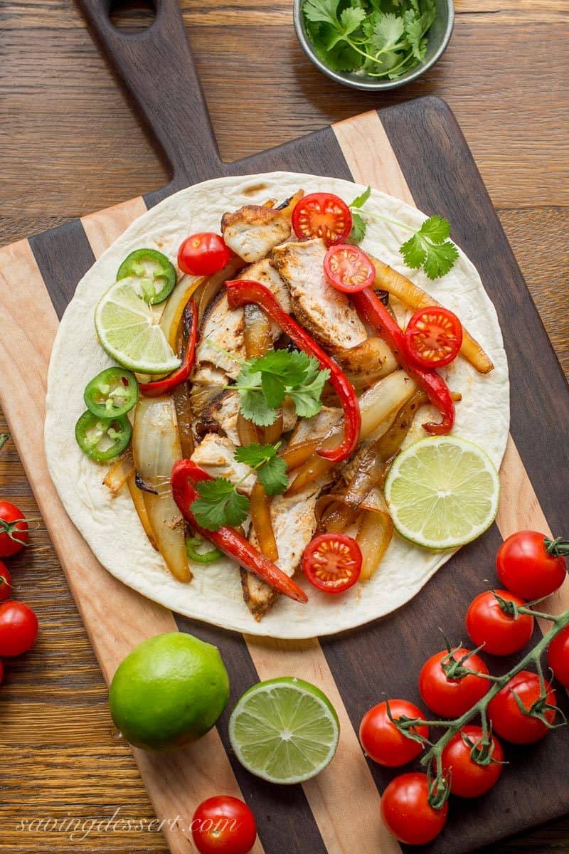 Skillet Chicken Fajitas ~ incredibly easy to make, loaded with bold flavor, sweet sautéed vegetables and tender, juicy chicken. www.savingdessert.com