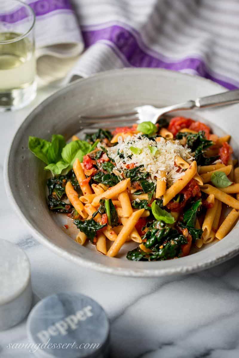 Spicy Pomodoro Sauce with Kale & Penne ~ a flavorful and healthy Meatless Monday meal that will leave you full, and satisfied. With just a few healthy ingredients and about 45 minutes, you can enjoy this spicy and delicious dish, and feel good about eating it too! www.savingdessert.com