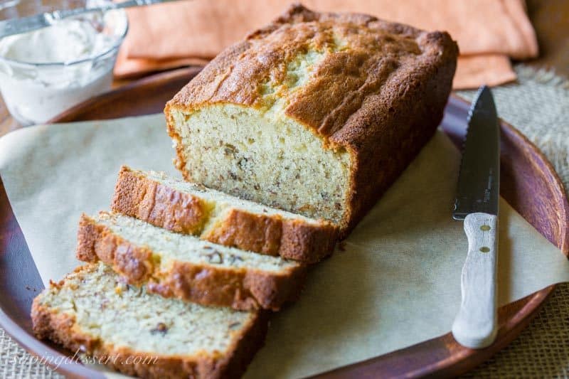 Easy Banana Bread Recipe ~ delicious and easy, and perhaps the best banana bread recipe around! Moist and tender cake loaded with banana flavor and chopped walnuts. Try a slice with cinnamon cream cheese - oh my goodness! www.savingdessert.com