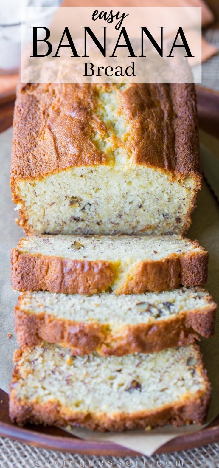 A sliced loaf of banana bread with walnuts