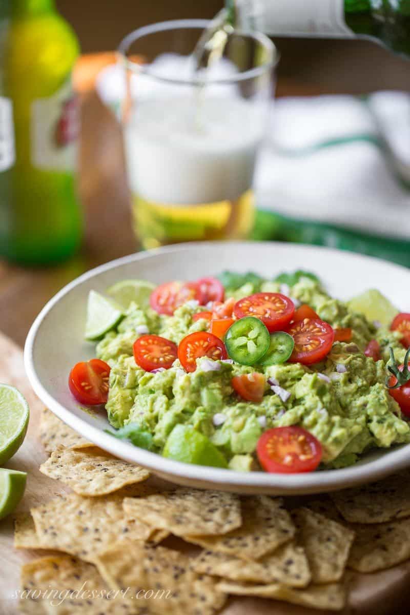 Easy Spicy Guacamole ~ incredibly delicious made fresh at your own table, hand crafted and seasoned just the way you like it ... and it's super easy to make too. www.savingdessert.com