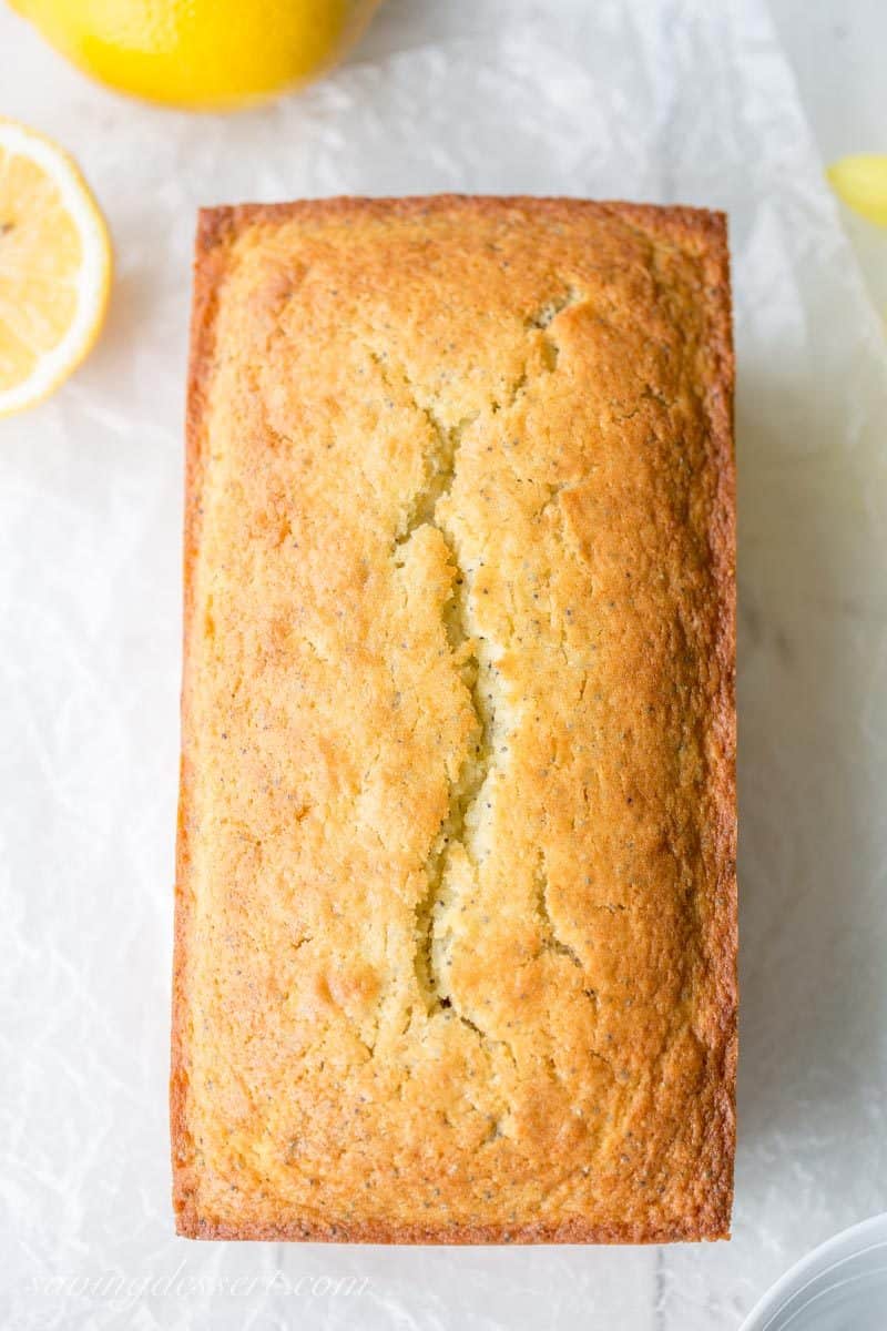Lemon Poppy Seed Bread ~ a super easy quick bread packed with poppy seeds and lemon then topped with a simple lemon glaze. A delightful and delicious loaf cake great served with breakfast, brunch, afternoon tea or even dessert. www.savingdessert.com