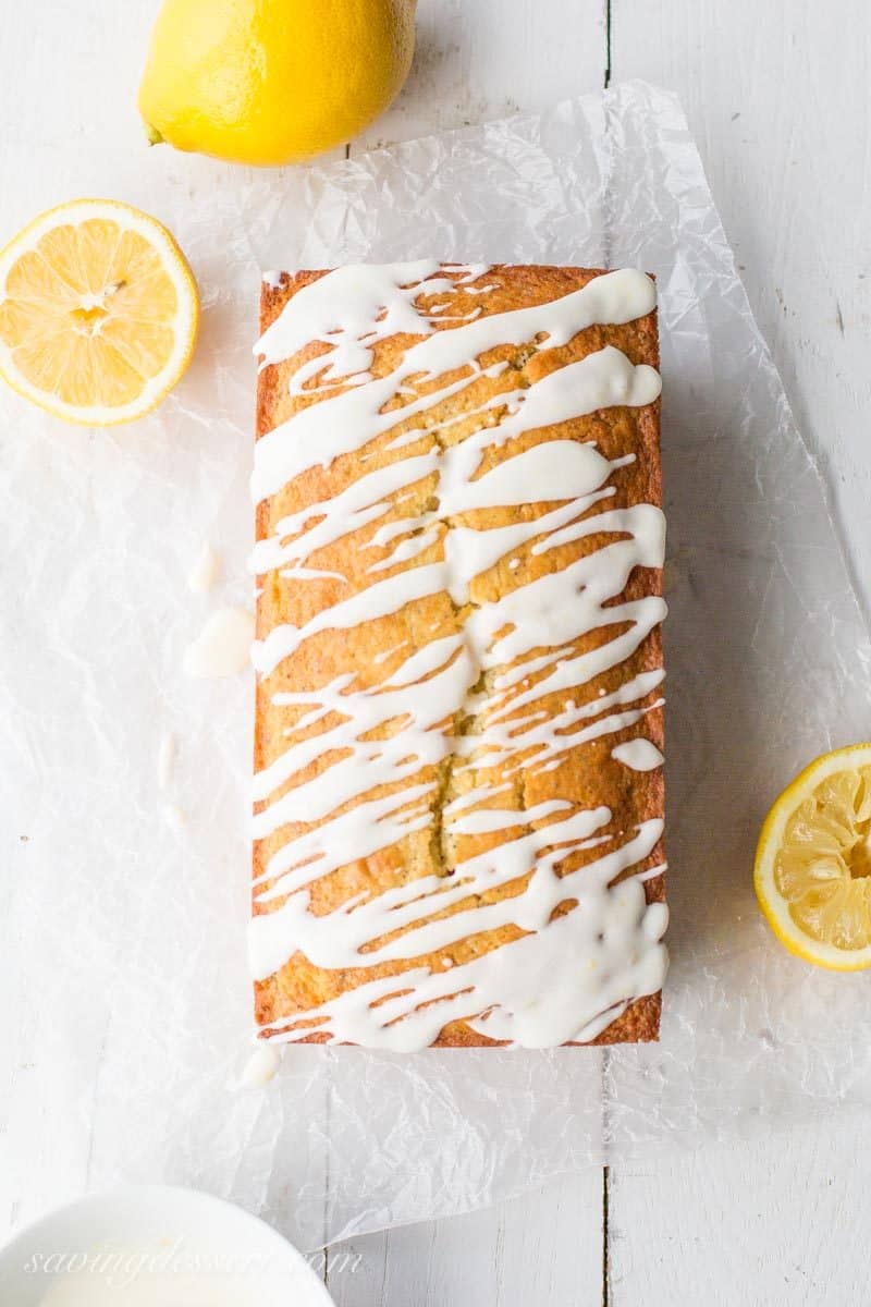 Lemon Poppy Seed Bread ~ a super easy quick bread packed with poppy seeds and lemon then topped with a simple lemon glaze. A delightful and delicious loaf cake great served with breakfast, brunch, afternoon tea or even dessert. www.savingdessert.com