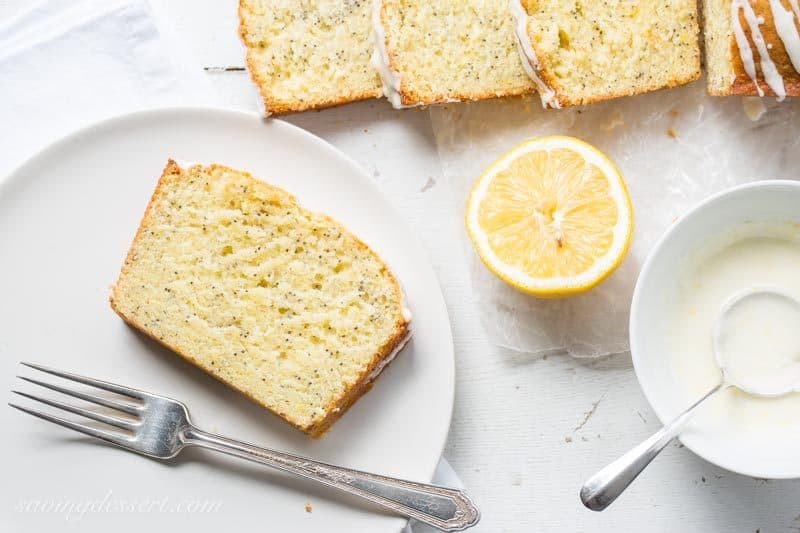 Lemon Poppy Seed Bread ~ a super easy quick bread packed with poppy seeds and lemon then topped with a simple lemon glaze. A delightful and delicious loaf cake great served with breakfast, brunch, afternoon tea or even dessert. www.savingdessert.com